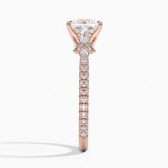 Lab Grown Primrose Diamond Engagement Ring - 14K Rose Gold. This feminine design features floral clusters that embrace the glistening center gemstone. Beaded detailing adds an air of timeless elegance to the band as it dazzles with French pavé diamond accents (3/8 total carat weight). Elegant Cluster Rose Gold Ring, Elegant Rose Gold Cluster Ring, Elegant Jewelry With Side Stones, Elegant Rose Gold Cluster Ring For Anniversary, Classic Rose Gold Cluster Jewelry, Dazzling Rose Gold Cluster Ring For Anniversary, Classic Rose Gold Cluster Ring For Formal Occasions, Timeless Rose Gold Cluster Ring For Anniversary, Timeless Rose Gold Cluster Anniversary Ring