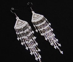 white beaded fringe earrings on black background