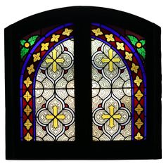 an ornate stained glass window with flowers and leaves