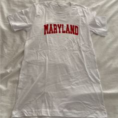 Maryland Umd Tee Shirt Size Small. New Without Tags Never Worn. White Summer T-shirt For College, White School Spirit Top For Spring, White Shirt With School Spirit For Spring, White College Style T-shirt With Letter Print, White College Style T-shirt With Text Print, White Summer T-shirt, Casual Style, Red Cotton College Style Tops, White Cotton Tops For School Spirit, White Cotton College T-shirt