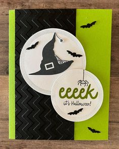 a paper plate with a trick or treat on it next to a green and black card