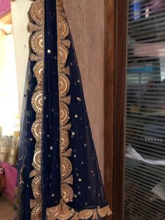 Blue net dupatta with sequin embroidery all over and scallop border on all sides. More dupatta here in our collection https://www.etsy.com/shop/neelcreations/?section_id=15880219 Beautiful net with sequin motifs all over dupatta. Indian dupattas for every occasion. ★ It can be made in other colors. ★We can increase its length also. Approximate length is 95 inches but if you want we will increase it. Please contact us for increased length. It has golden border scallop design. Perfect head wrap. T Blue Dupatta With Dori Work In Traditional Drape, Blue Resham Embroidered Net Dupatta, Blue Net Dupatta With Resham Embroidery, Blue Chinon Dupatta With Mirror Work, Blue Dupatta With Mirror Work In Traditional Drape, Blue Bollywood Dupatta With Mirror Work, Anarkali Blue Dupatta With Dori Work, Royal Blue Saree With Dupatta For Navratri, Blue Chinon Traditional Wear With Dupatta