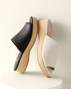 A casual slide in rich leather with a slight wedge, for an everyday slip-on that's a touch above the rest. Well crafted with comfy padding and a sustainable-wood base.  By EILEEN FISHER. Leather-wrapped padded footbed. Wood wedge and platform. Man-made sole. Spring Everyday Clogs With Cushioned Footbed, Spring Clogs With Cushioned Footbed For Everyday, Comfortable Cushioned Wedge Heel Slides, Spring Leather Footbed Clogs For Everyday, Modern Slide Clogs With Leather Footbed, Spring Comfortable Platform Slippers With Leather Footbed, Comfortable Leather Footbed Platform Slippers For Spring, Comfortable Leather Footbed Mules With Wedge Heel, Modern Leather Footbed Slide Clogs