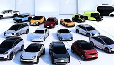 a bunch of cars that are all different colors and sizes in the same row on a white surface