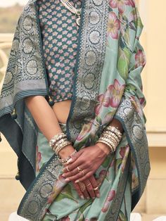 This stunning mint green floral printed silk saree with blouse is the perfect choice for weddings, festivals, and other special occasions. Its vibrant color and intricate print work make it a standout choice for anyone looking to make a statement. The zari weaving work adds an extra touch of elegance and luxury to the saree, making it a must-have in your ethnic wear collection.
The 5.50 meters of saree material and unstitched blouse material give you plenty of fabric to work with, allowing you t Designer Green Lehenga With Printed Motifs, Green Cotton Silk Blouse Piece With Dupatta, Green Pre-draped Saree With Printed Motifs For Diwali, Designer Green Tussar Silk Sets, Designer Green Floral Lehenga, Designer Green Floral Print Lehenga, Green Cotton Silk Pre-draped Saree For Festivals, Traditional Floral Print Choli, Designer Wear Transitional Green Blouse Piece