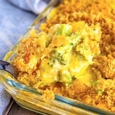 a casserole dish with broccoli and cheese in it, ready to be eaten