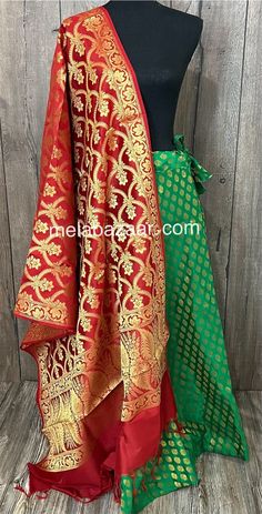 Set of Banarsi dupatta and brocade skirt with a big flare. Skirt Length: 40 inches  Skirt Waist : Drawstring waistband, One size ( fits upto 38 inches waist) Red Banarasi Silk Lehenga With Sheer Dupatta, Green Sharara With Tilla For Festive Occasions, Festive Green Sharara With Tilla Details, Festive Green Sharara With Tilla, Red Art Silk Lehenga With Tilla Detail, Banarasi Silk Sharara With Tilla Traditional Drape, Traditional Brocade Lehenga With Sheer Dupatta, Traditional Green Sharara With Tilla Detailing, Traditional Green Sharara With Tilla