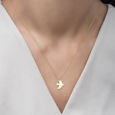 14K Gold Bird Necklace, 925 Silver Bird Pendant, Bird Jewelry, Bird Charm, Swallow Necklace, Animal Jewelry, Gifts For Her Handmade Bird Jewelry Material: 925 Sterling Silver or 14K Gold Chain Length: 17 inches - (45cm) / 19 inches - (50cm) / 21 inches - (55cm) Chain Style: Cable Colour: Rose - Silver - Gold Pendant Size: 1,00cm X 1,20cm Minimalist Bird Charm We Are a Jewelry Manufacturer, We Do Wholesale Click the link below for similars: https://www.etsy.com/shop/Dzgsilver?ref=seller-platform- Yellow Gold Bird Design Pendant Jewelry, Round Necklace With Bird Design For Gift, Bird Design Necklace Gift, Swallow Necklace, Jewelry Manufacturer, Silver Bird, Bird Necklace, Bird Charm, Bird Pendant