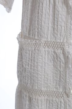 "Stunning vintage 1970s white bohemian Mexican dress Textured cotton with crochet lace stripes Side pockets button down front + angel wing sleeves Excellent condition M e a s u r e m e n t s: Size: fits like a S M BUST: 19\" Waist: 20\" Hips: 21 1/2\" Total Length: 51\" Label: N/A Fabric: cotton Sleeves: 13\" +All Measurements are taking while garment is lying flat+ + Jewelry, belts, and any other accessories are NOT included unless specifically stated in description+ i n s t a g r a m: cali_vin White Cotton Crochet Dress For Spring, White Crochet Cotton Dress For Spring, White Cotton Crochet Dress, White Crochet Dress With Lace Trim For Daywear, Spring Cotton Crochet Dress For Daywear, Bohemian Cotton Dresses With Broderie Anglaise, Bohemian Cotton Crochet Dress With Lace Trim, Bohemian Crochet Cotton Dress With Lace Trim, White Bohemian Cotton Crochet Dress