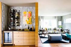 a living room filled with furniture and a wine rack