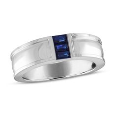 a men's ring with blue sapphire stone in the center and white gold band