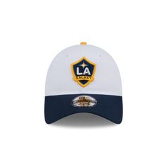 The LA Galaxy 2024 Jersey Hook 9TWENTY Adjustable Cap features an embroidered Galaxy logo at the front panels with a team script at the right-wear side and an adjustable closure at the rear. White Baseball Cap For Fan Merchandise, White Throwback Baseball Cap For Sports Events, White Fitted Hat For Sports Events With Embroidered Logo, White Fitted Hat With Embroidered Logo For Sports Events, White Fitted Hat With Embroidered Logo For Sports, Collegiate White Six-panel Baseball Cap, White Collegiate Six-panel Baseball Cap, White Baseball Cap With Embroidered Logo For Fans, White Fitted Baseball Cap With Logo Patch