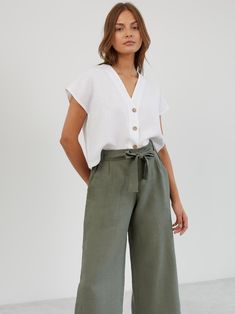 ALLIE is a pair of relaxed-fit, wide-leg cropped linen pants. They feature a high-waisted paper bag design with a self-tie belt, offering both comfort and style for a variety of occasions. DETAILS - High-rise paperbag waist - Wide-leg cut for a relaxed, flowy fit - Cropped length - Pleated front COLOR - Sage Green (featured color) - Multiple colors available in dropdown menu above - See all color options & order fabric samples here: https://www.etsy.com/listing/586569696/linen-fabric-samples SIZ Summer Casual Culottes, Casual Summer Wide-leg Culottes, Cropped Wide Leg Pants For Summer Workwear, Casual Cropped Bottoms For Vacation, Casual Summer Culottes For Day Out, Relaxed Fit Cropped Bottoms For Summer, Casual High-waisted Culottes For Day Out, Casual Cropped Wide Leg Pants With Pockets, Spring Vacation Cropped Pants