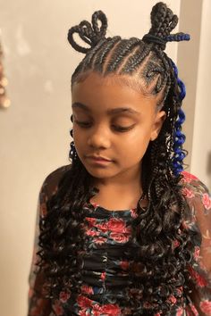 This fun and unique hairstyle has very detailed braids called cornrows that begin at the front and go along the head, ending with nicely curled extra hair added in. The cornrows have silly and enjoyable hair things in them, making different colors and personality stand out. The style is finished with loose, wavy hair at the ends that add a bit of - Click to see more of 20 Cute Cornrow Hairstyles for Children and follow us for more hairstyle ideas. // Photo Credit: Instagram @chocolat_stylesz Loose Wavy Hair, Hair Things