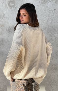 Cream Oversized Sweater

How to Style:
Stay cozy and warm in our cream oversized sweater (). Style it with leggings or jeans () and ankle boots () for a comfy yet stylish look perfect for a relaxed day or a sunset picnic!

Features:


  
 * Chunky knit fabrication 
 * Crew neckline 
 * Full length 
 * Cable knit design on the side and sleeves 
 * Oversized fit 
 * Long sleeve style 
 * Unlined 
 * Heavy weight material 
 * Slight stretch 
 * Pull on style Comfy Fall Sweater For Cold Weather, Comfy Sweater For Cold Weather And Fall, Trendy Cream Sweater With Ribbed Cuffs, Beige Relaxed Fit Sweater For Winter, Casual Off White Cable Knit Sweater, Casual Off-white Cable Knit Sweater, Off White Textured Knit Sweater For Fall, Neutral Cable Knit Sweater For Winter, Casual Everyday Cable Knit Sweater