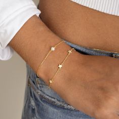 "Such a cute star bracelet, featuring 6 star charms. This bracelet is great for stacking or on its own! Also makes for a special gift!  - - - D E T A I L S - - -  * THICK plating of 14k Gold or Rhodium over 925 Sterling Silver * Available in 6.25\" or 6.75\" + .5\" Ext Chain * Lobster clasp closure * Nickel-free & Hypoallergenic  PEARL BRACELET ON MODEL: https://www.etsy.com/listing/1553833249/pearl-bracelet-dainty-bracelet-delicate Made with 100% Pure Love! ♡ Comes in a gift-box, ready for gift-giving! 🎁 Happy to answer any questions you may have! 🥰 Let's Connect! 🥰 IG: samijewels_" Dainty Adjustable Chain Bracelet With Star Charm, Dainty Star-shaped Bracelets For Everyday Wear, Adjustable Star Charm Chain Bracelet, Dainty Adjustable Star-shaped Bracelet, Dainty Star-shaped Adjustable Bracelets, Dainty Star-shaped Adjustable Bracelet, Jewelry Closet, Bracelet Star, Pearl Bracelet Gold