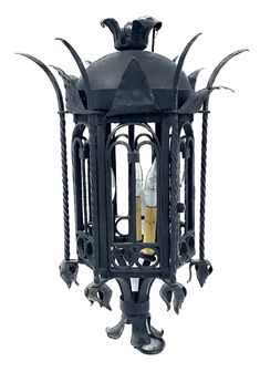 an old fashioned lantern with candles in it's caged design on white background