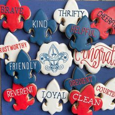 decorated cookies are displayed on a blue tablecloth with red, white and blue lettering