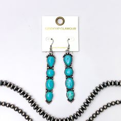 Silver fish hook earrings with a four, turquoise stone pendant. These earrings are pictured on a white background with silver beads at the bottom of the picture. Giddy Up Glamour, Turquoise Stones, Turquoise Stone, Sale Items, Unique Design, Silver Tone, Unique Designs, Dye, Turquoise