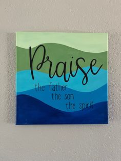 a painting on the wall that says, praise the father is the son of the spirit