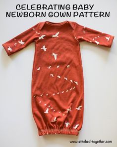 a red baby gown with white birds on it and the words celebrating baby newborn down pattern