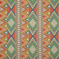 an orange, green and blue pattern on fabric