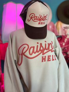 Gear up for some serious attitude with our 'Raisin' Hell' Graphic Sweatshirt. Printed on super soft unisex fleece-lined sweatshirts., this rugged sweatshirt is perfect for those who dare to push the boundaries and make their mark. Whether you're tearing up the streets or causing a scene with your crew, this sweatshirt is your go-to for comfort and cool vibes. These fit true to size - size up for an oversized look. Southern Style Outfits, Southern Boutique, Wedding Dresses Black, Western Vibes, Casual Bodysuit, Country Wedding Dresses, Sequin Party Dress, Sweater Tank Top, Comfortable Outfits