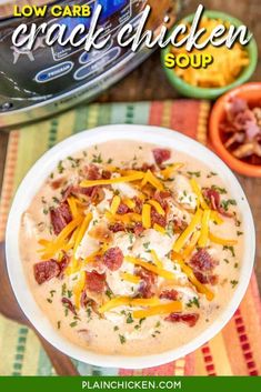 a bowl of cracker soup with cheese and bacon on top, next to an instant pressure cooker