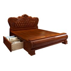 a wooden bed with an open drawer underneath the headboard and foot board is shown