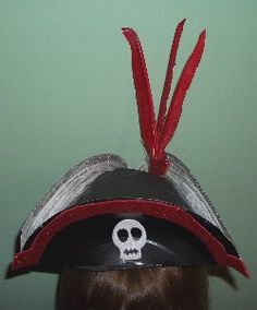 a person wearing a pirate hat with a skull on it