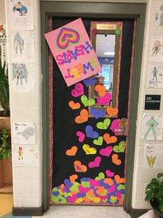 a door decorated with hearts and the words happy valentine's day