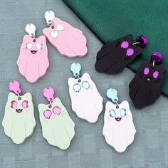 Spooky Kitty earrings are fun for any time of the year. Current colorways include Void (black with purple eyes), Light (white with light blue eyes), Spring (pastel green with pink eyes), or Blush (pink with silver eyes). They are made with mirror and matte acrylics and engraved with details. A cute accessory for any aesthetic. Get them with default studs as pictured, or if you select fishhooks, huggies/leverbacks, or clip-ons the teardrop on top will be replaced. If you would like gold-toned met Matte Acrylics, Spooky Kitty, Silver Eyes, Light Blue Eyes, Laser Projects, Really Cute Dogs, Silver Eye, Spring Pastels, Ghost Cat