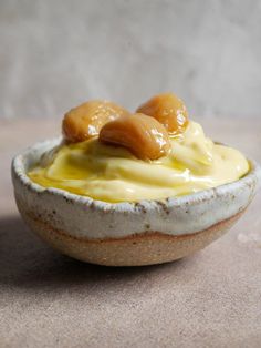 a small bowl filled with food on top of a table