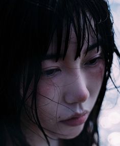 a close up of a woman with wet hair