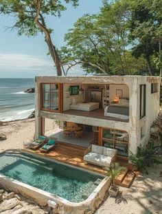 a house on the beach with a hot tub