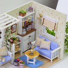 a doll house with furniture and accessories in it