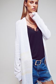 Upgrade your wardrobe with our Midi Colourblock Cardigan in White. This cardigan is crafted from a blend of 30% viscose, 40% acrylic, and 30% polyamide, offering a soft and comfortable feel. With its regular fit and midi length, it provides a versatile and flattering silhouette. The colour-block print adds a stylish and eye-catching element to the cardigan, while the long sleeves and relaxed fit ensure comfort and ease of movement. Perfect for a boho-inspired look, this cardigan features a fine White Soft Knit Sweater Coat For Layering, Soft Knit White Sweater Coat For Layering, White Open Front Sweater For Layering, Open Front Soft Knit Cardigan For Layering, Soft Knit Open Front Cardigan For Layering, Chic White Cardigan For Layering, Versatile White Winter Cardigan, White Bohemian Knit Outerwear, White Long Sleeve Patchwork Cardigan