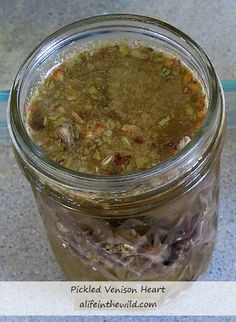 a glass jar filled with food sitting on top of a table