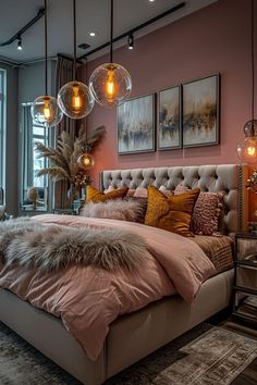 a large bed sitting in a bedroom next to a window with hanging lights above it