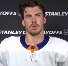 an image of a hockey player in the press room for his team's media conference