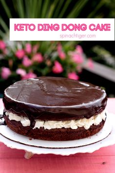 a chocolate cake sitting on top of a white plate