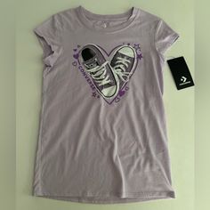 Brand New With Tags, Cute Light Purple Converse All Star T-Shirt. Casual White Converse Tops, Converse Cotton Graphic Tee, Converse Graphic Print Short Sleeve T-shirt, Casual Short Sleeve Top With Star Print, Converse Cotton Crew Neck Top, Converse Graphic Tee In Cotton, Converse Graphic Tee Cotton Top, Casual T-shirt With Star Print For Spring, Converse Cotton Crew Neck T-shirt