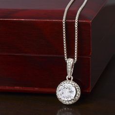 Surprise your loved one with a timeless and elegant gift. Our dazzling Eternal Hope Necklace features a center cushion cut cubic zirconia that will sparkle with every step. The center crystal is adorned with equally brilliant CZ crystals, ensuring a stunning look every wear. Wow her by gifting her an accessory that will pair with everything in her wardrobe! 14k white gold finish over stainless steel 8mm center cushion-cut cubic zirconia crystal 1.2mm accent CZ crystals Pendant dimensions: 0.6" ( Crystals Pendant, Surprise Your Girlfriend, Promise Necklace, Wife Necklace, Hope Necklace, Solitaire Necklaces, White Gold Necklaces, Crystal Necklace Pendant, Elegant Necklaces