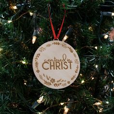 a wooden ornament hanging on a christmas tree