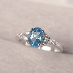 * The delicate ring displays swiss blue topaz as main stone. The cluster side stones make the ring similar to the blooming flower . For who wearing this special & delicate ring, will shine like a goddess. ◆ Production Description: Main stone Type: swiss blue topaz Main Stone Shape: Oval Cut Main Stone Size: 6*8mm (1.47ct) Side stone: CZ Metal: 925 Sterling silver - Other options available in the drop down menu ◆ Customization: √Free for Add Engraving √Other Metal Type Available √Other Gemsto Oval Turquoise Topaz Ring For Wedding, Oval Turquoise Topaz Promise Ring, Turquoise Oval Topaz Promise Ring, Turquoise Topaz Oval Ring For Promise, Oval Light Blue Topaz Ring, Light Blue Oval Topaz Ring, Personalized Promise Rings, July Birthstone Ring, Swiss Blue Topaz Ring