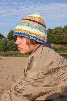 Dive into the softness and cosiness of our new woolen beanie hat with multicolored stripes. Spend the fall-winter season with flair. Our beanie is made of high quality merino wool. Garment made of warm bulky yarn, knitted by hand. Needless to say this is the epitome of soft & cozy. This is a small thing that can make your F/W outfit sing. Perfect for the upcoming F/W season. Handmade with love. Ravelry Oslo Hat, Cheap Multicolor Winter Beanie, Affordable Knitted Streetwear Hats, Knitted Hats Men, Knitted Beanie For Men, Laine Hat, Knit Beanie Outfit, Beannie Hat, Colorful Beanie