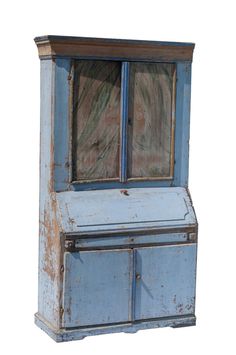 an old blue cabinet with glass doors on the top and bottom, against a white background