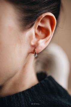 ✨ Elevate Your Style with Our 18K Gold Vermeil Earrings ✨ Embrace timeless sophistication with our handcrafted 18K Gold Vermeil Earrings, a fusion of luxury and artisanal skill. Each pair is forged from solid 925 Sterling Silver, enveloped in a radiant 18K gold vermeil, and illuminated by the sparkle of high-quality CZ Diamonds. Designed with your well-being in mind, they are hypoallergenic, nickel-free, and waterproof, ensuring lasting brilliance for every occasion. Our earrings are presented in a ready-to-gift, plastic-free package, ideal for those who cherish both elegance and the environment. With O'Milo, you're not just choosing jewelry--you're choosing a story of craftsmanship and sustainability, ready to be worn, cherished, and gifted with pride. HIGHLIGHTS Base: Solid 925 Sterling Small Earrings Gold, Engagement Celebration, Diamond Hoop Earrings, Small Earrings, Cz Diamond, Jewelry Earrings Hoops, Diamond Sizes, Soft Lighting, Solid 925 Sterling Silver