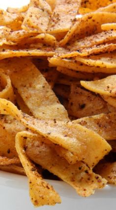 a plate full of seasoned tortilla chips