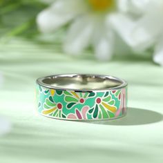 Add a serious dose of radiance to your outfit with splash of color! Bright and whimsical, the silver enamel band ring makes a statement with any outfit. Combine this trendy piece with other enamel pieces to vibrant and radiant effect. Enjoy the benefits of it, such as brining good luck and love, enhancing health and beauty.Weight: 5.84 gWidth: 7.2 mmHeight: 1.7 mmThickness: 1.6 mmMaterial: 925 SilverPlating Color: Silver Enamel Jewelry For Spring Gifts, Spring Enamel Jewelry For Gifts, Spring Enamel Jewelry As Gift, Hand Painted Jewelry As Spring Gift, Hand Painted Jewelry For Spring Gift, Spring Gift Enamel Jewelry, Multicolor Enamel Ring As Gift, Multicolor Enamel Ring For Gift, Bohemian Green Rings For Summer